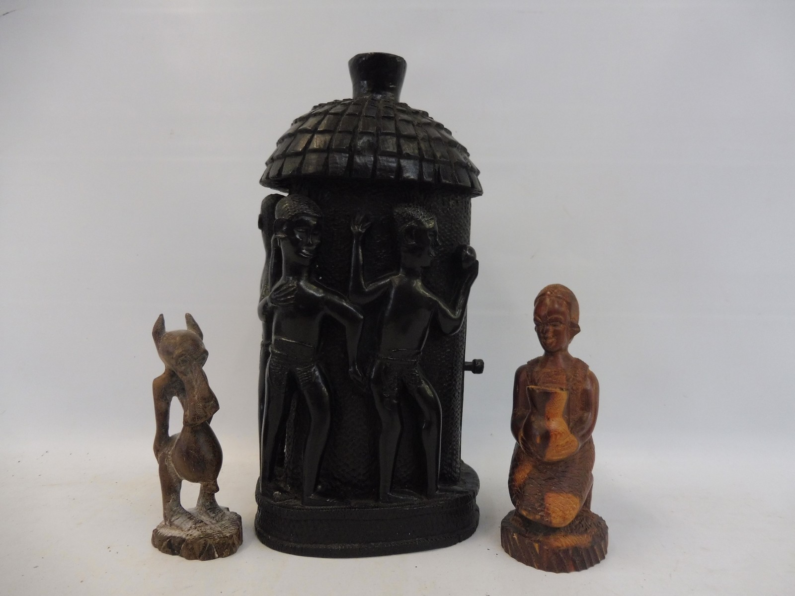 Three Nigerian tribal carvings.