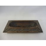 An Arts and Crafts carved oak desktop pen tray, 12 3/4" wide.