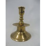A 17th Century Continental brass capstan candlestick with turned column and mid drip pan, 5 1/2" h.