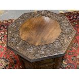 A very good quality carved octagonal occasional table on a folding base, the top 18 x 18", 19" h.