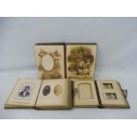 Three Edwardian leather photograph albums, two with assorted photographic contents.