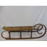 An early 20th Century ash and elm sledge of large proportions, approx. 57" long.