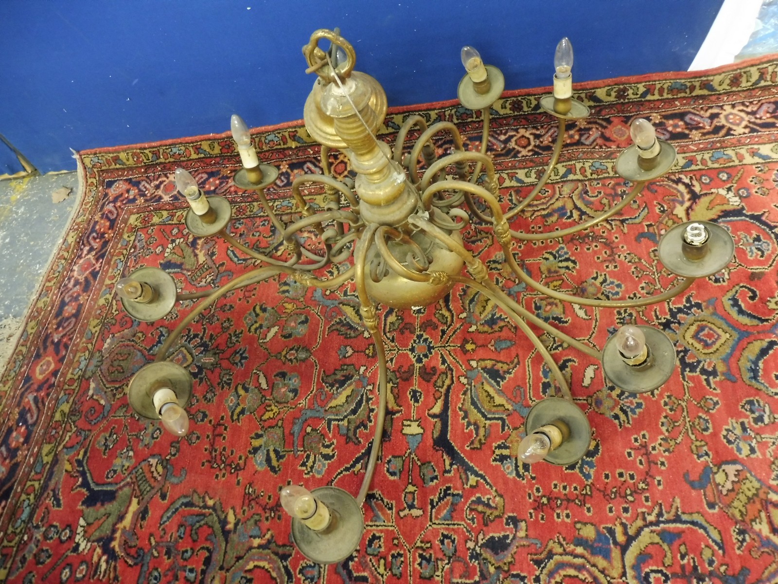 A large and impressive 12 branch brass chandelier.