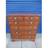 A George III oak and mahogany crossbanded chest of two short over four long drawers, in two parts,