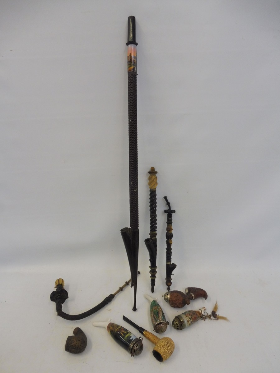 An interesting collection of porcelain and other pipes plus parts including horn and hardwood.
