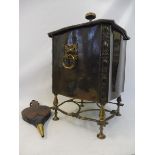 An Arts and Crafts brass mounted coal scuttle plus a pair of bellows.