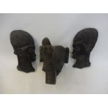 Two ethnic tribal wall masks plus a carved wooden elephant head.