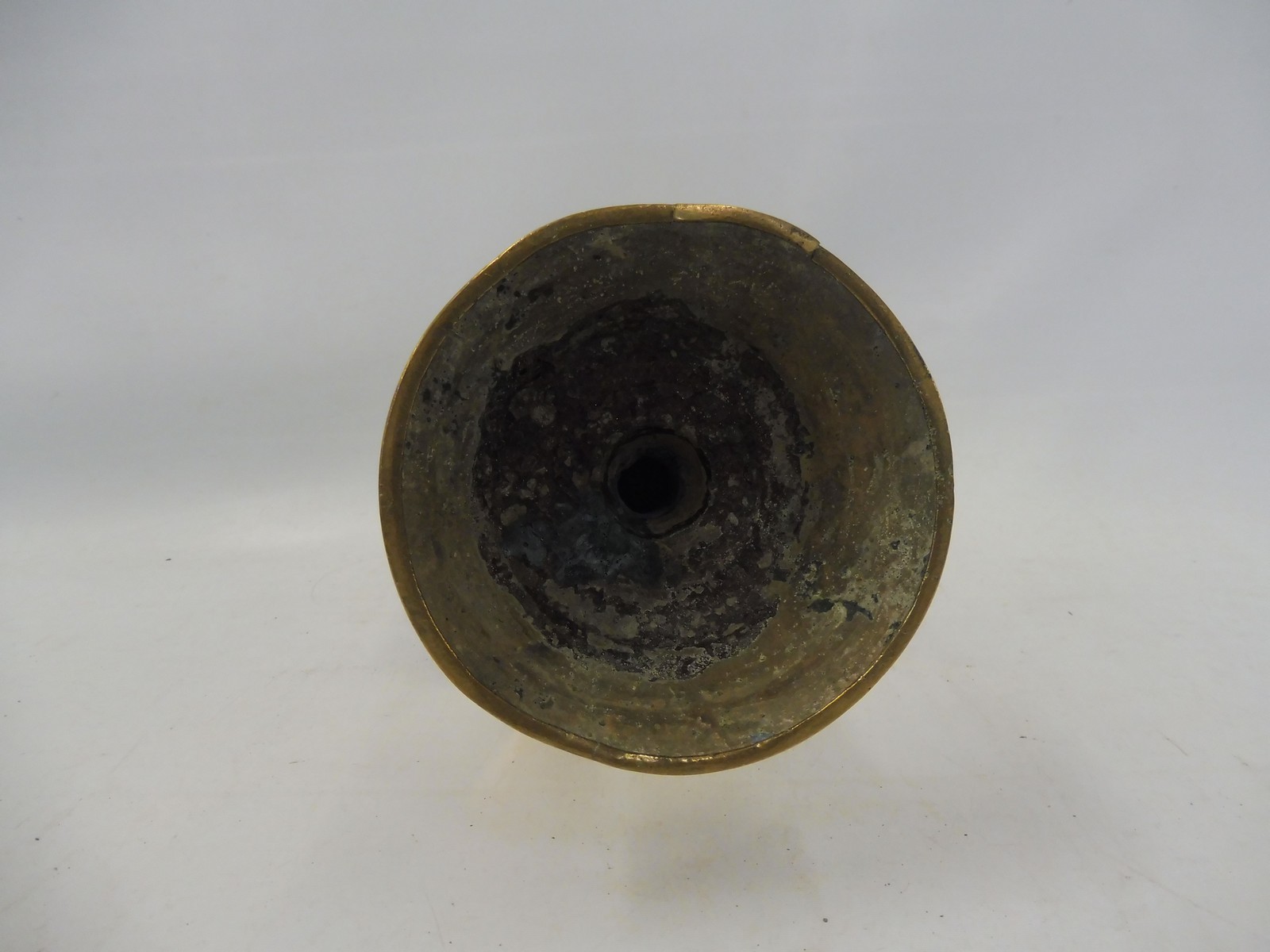 A 17th Century Dutch West Indies brass pricket candlestick with a broad mid drip pan, 11" long. - Image 5 of 5