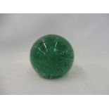 A Victorian green glass dump door stop decorated with bubbles, 4 1/2" h.