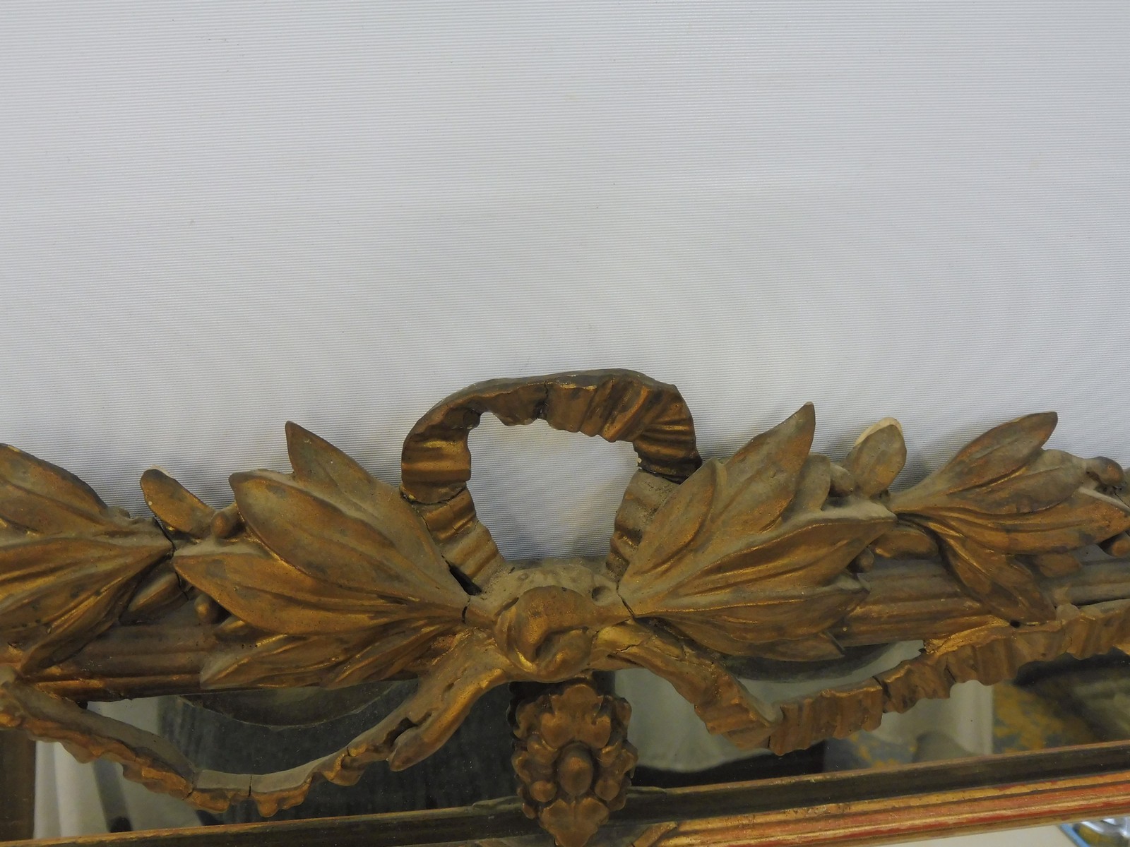 A 19th Century gilt framed border glass wall mirror with leaf and bow design pediment, depository - Image 4 of 6