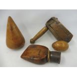 A Victorian ash bird scarer, a sailor's fruitwood sail rubber, a lignum turnpin and a treen egg.