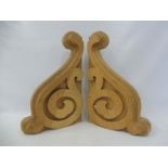 A pair of carved wooden corbels, each 11 x 17 1/2".