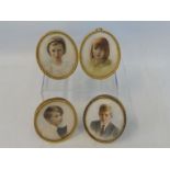 A group of four oval portrait miniatures.