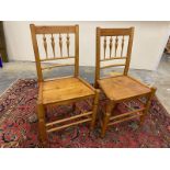 A pair of early 19th Century ash and elm country chairs, stamped with maker's initials.