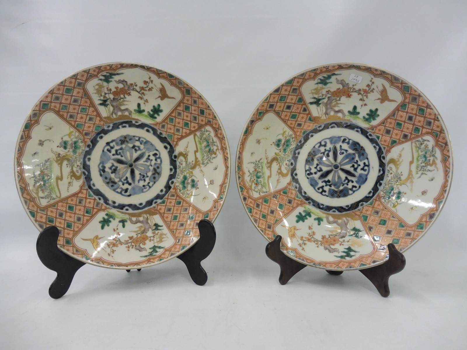 A pair of 19th Century Oriental saucers, each 12" diameter.