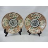 A pair of 19th Century Oriental saucers, each 12" diameter.
