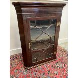 A mahogany astragal glazed wall hanging corner cabinet, 30" w x 41 1/2" h x 19" d.