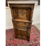 An Ipswich style oak court cupboard of good colour with carved front panels, single drawer and