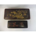 Two late 19th Century/early 20th Century chinoisserie lacquered glove boxes.