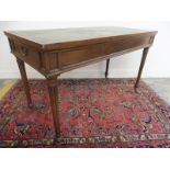 A mahogany rectangular leather topped writing desk with a single drawer to each end, raised upon