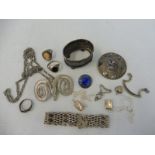 A tray of silver and other white metal items.