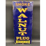 A 'Smoke Walnut Plug' narrow enamel sign, 12 x 30".