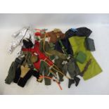 A quantity of 1960s, 1970s and 1980s Action Man clothing and accessories, weapons and one figure