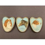 Three miniature heart shaped Clarnico cachou tins in very good condition.