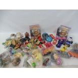 A box of assorted plastic toys including Mr Potato Head etc.