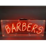 A Barbers neon illuminated sign, 38" wide x 14 3/4" high x 3" deep.
