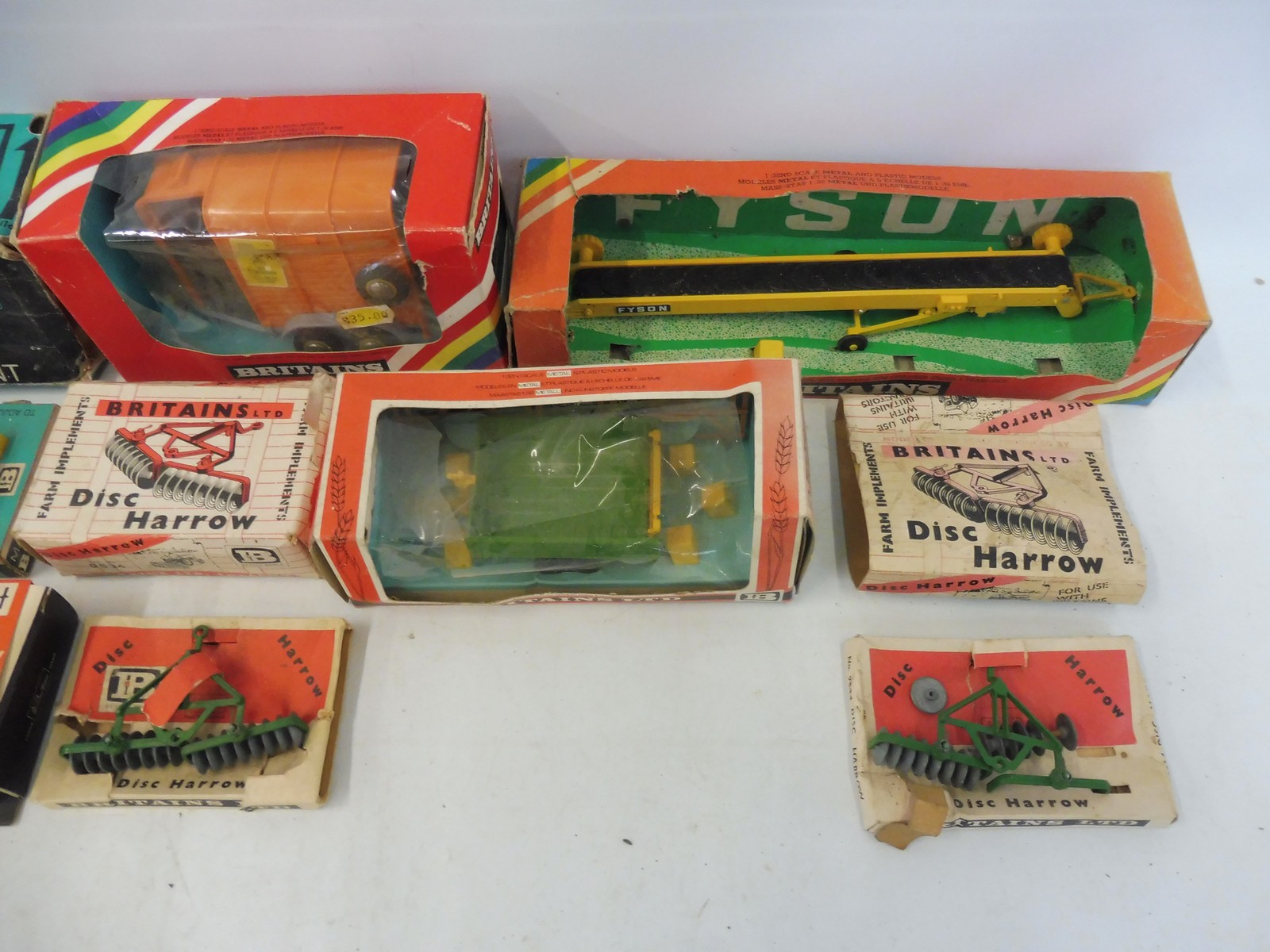 An assortment of Britains farm accessories from different eras, boxes in various conditions. - Image 3 of 3