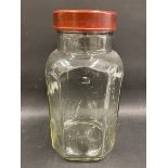 A Holland Toffee glass sweet jar with original scew on bakelite lid.