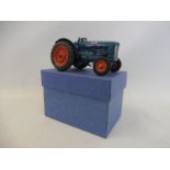 A well-detailed die-cast Britains Fordson tractor with swing axle.