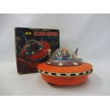 A boxed circa 1960s flying saucer with space pilot, made in Japan, in untested condition.