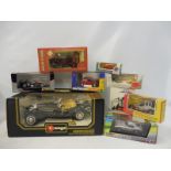 A Burago Mercedes roadster, an onyx Panoz and eight other boxed vehicles, various scales.
