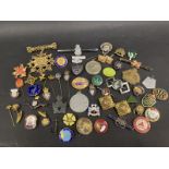 A collection of lapel badges including Royal British Legion, Intelligence Corps, LMS Railway Service