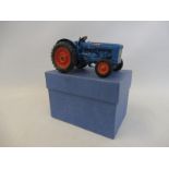 A well-detailed die-cast Britains Fordson tractor with swing axle.