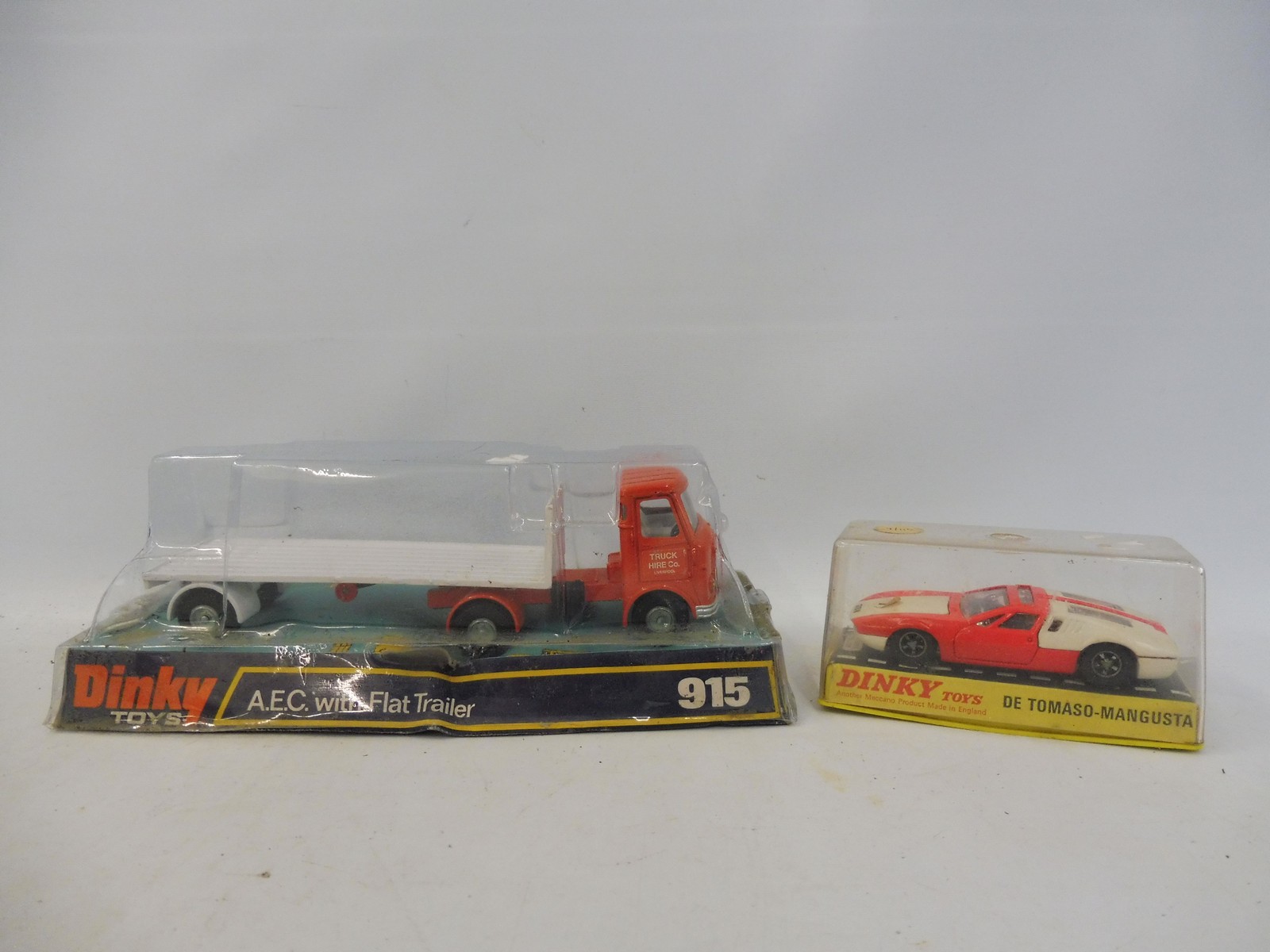 Two circa 1970s Dinky models, one an AEC flat trailer, the other a De Tomaso Mangusta.