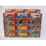 Twelve boxed Hobby Dax die-cast commercial vehicles.