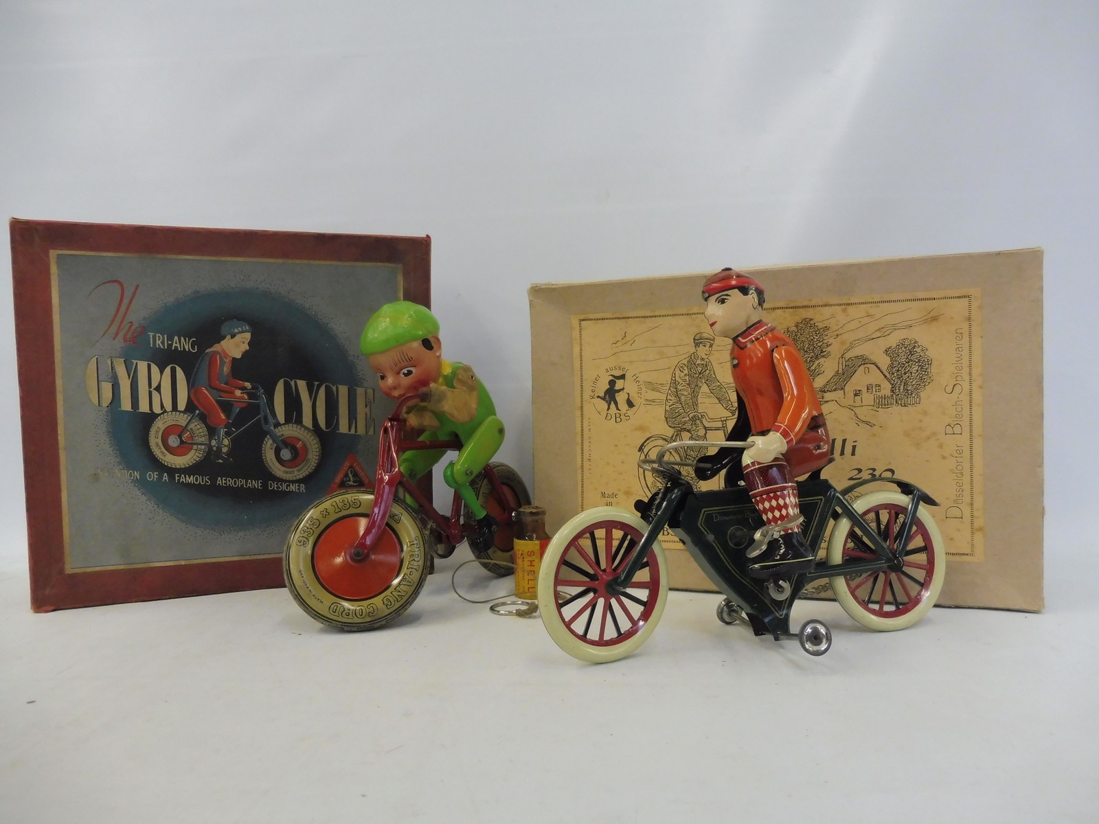 A boxed Tri-ang Gyro-Cycle and a boxed German 'Rolli 230' tinplate bicycle.