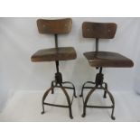 A pair of original circa 1950s industrial workshop chairs, swivel mechanism to adjust height,