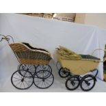 A Victorian style pram and a 1950s dolls pram.