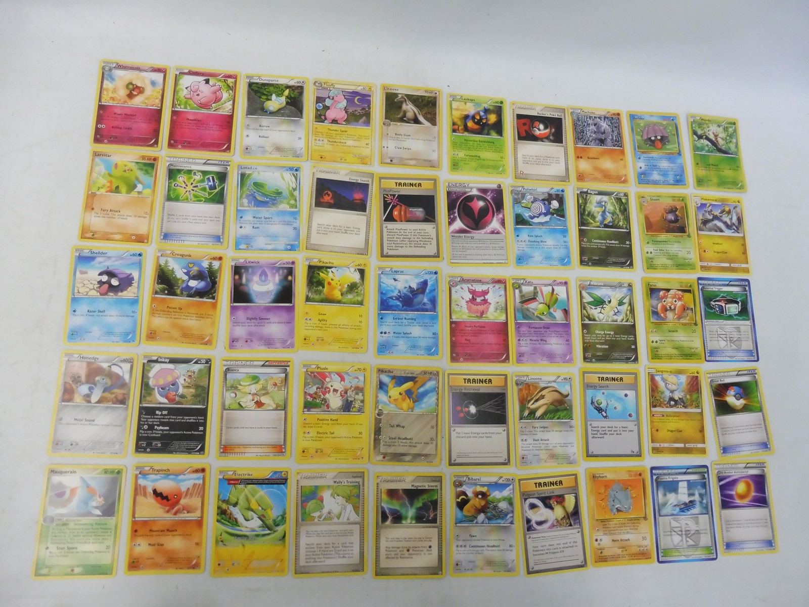 Pokemon tin full of Holo, commons and uncommon cards around 500 in good condition. - Image 2 of 3