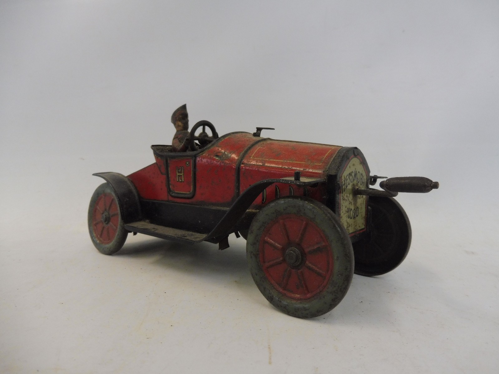 An early tinplate clockwork model car 'Hessmobil 1020'.