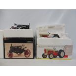 Two boxed tractors, one Ford Golden Jubilee, the other a Farmall.