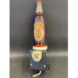 A Newcastle Brown Ale counter display bottle.