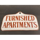 A rare small size enamel sign for 'Furnished Apartments', in very near mint condition, 8 1/4 x 5".