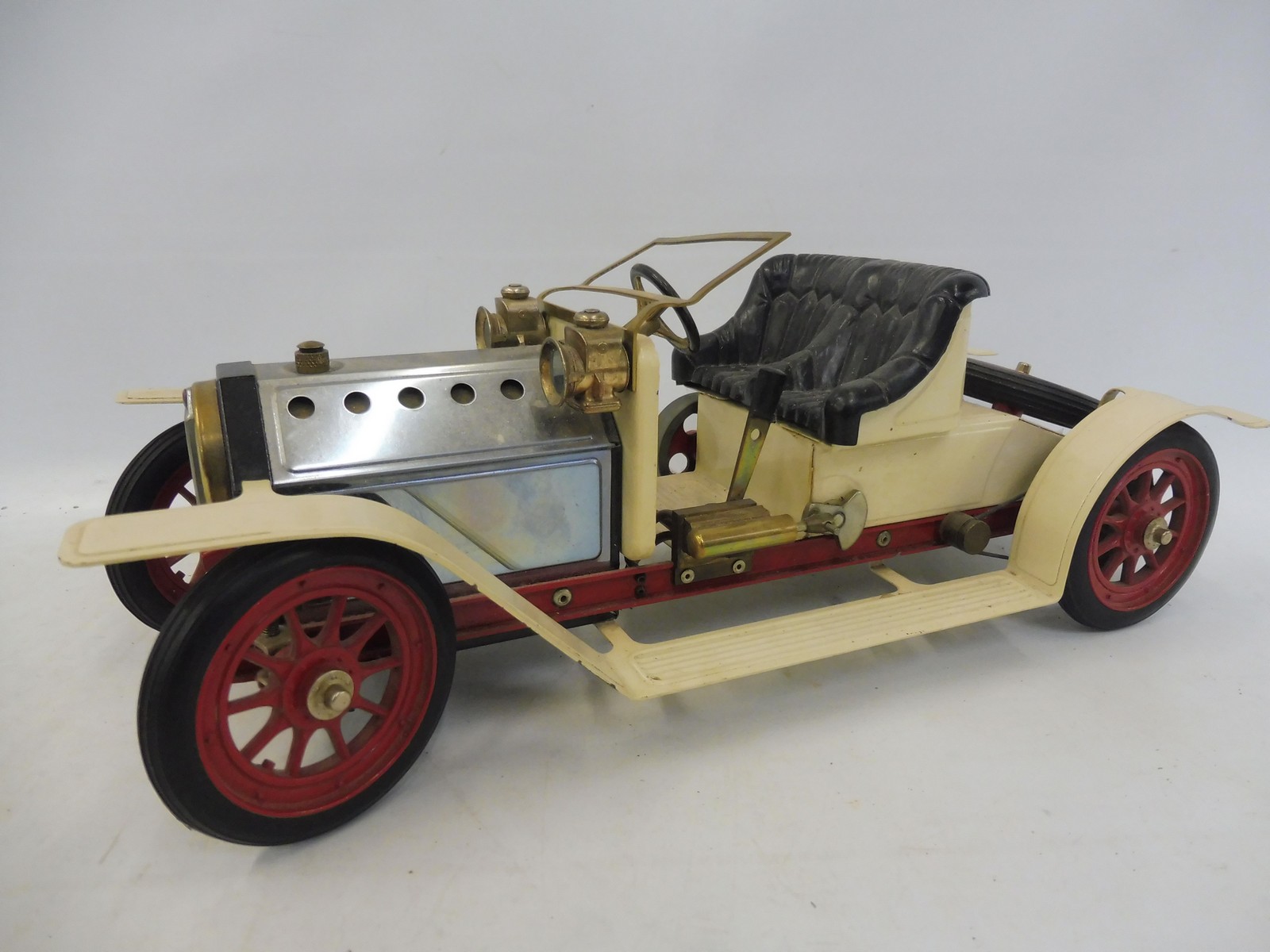 A Mamod 'Steam Roadster' live steam model of an Edwardian motor car.