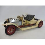 A Mamod 'Steam Roadster' live steam model of an Edwardian motor car.