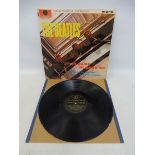 A rare copy of Beatles Please Please Me, on the black and gold parlaphone label, Mono, cover in